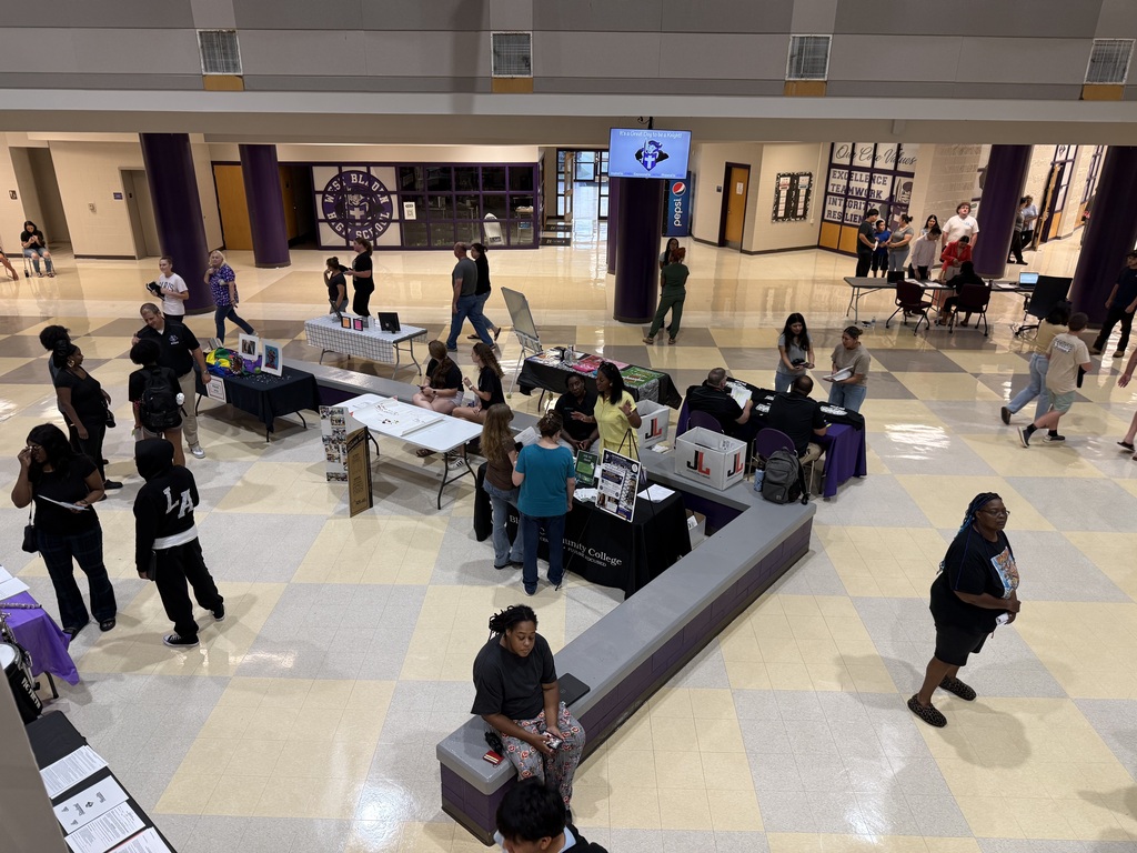 A birdseye eye view of the West Bladen High School atrium that is set up with tables for student clubs and check in.