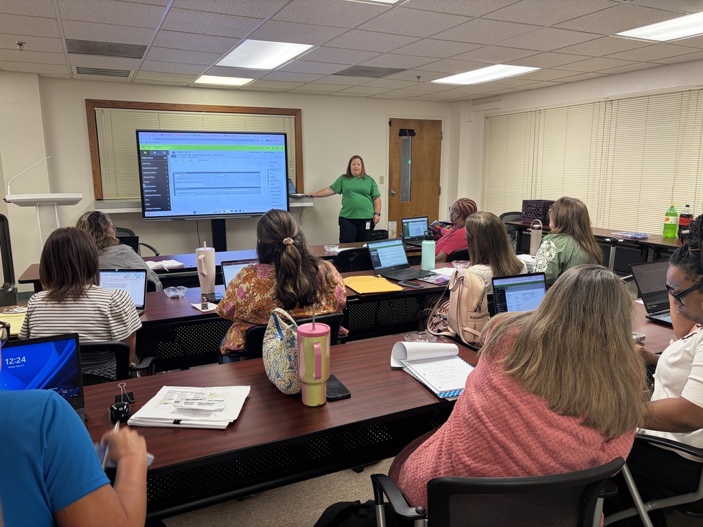 District data managers attend training with the district's student information system specialist.