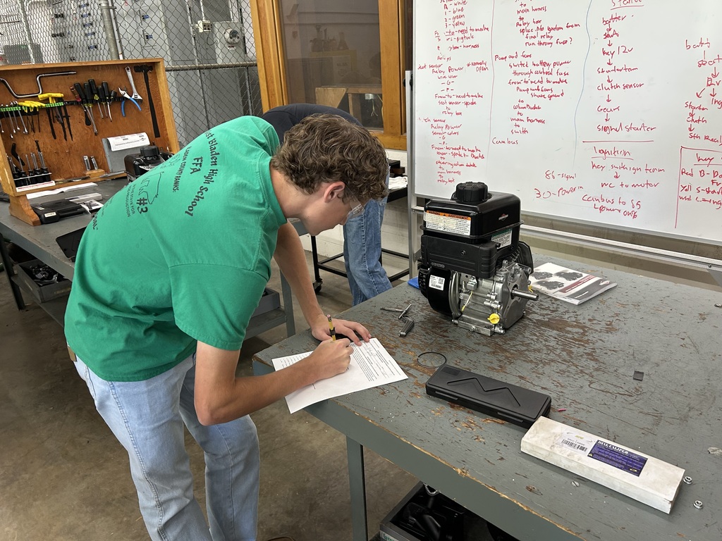 Student working on a small engine.