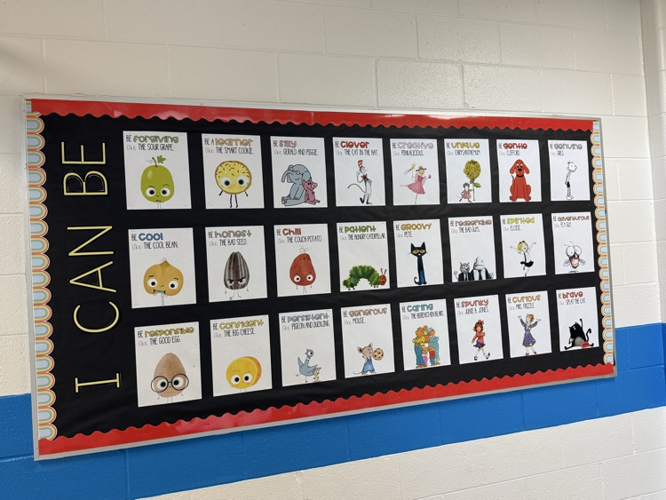     A school bulletin board displays colorful children’s book characters and positive messages encouraging students to “Be” forgiving, creative, responsible, brave, curious, and more.