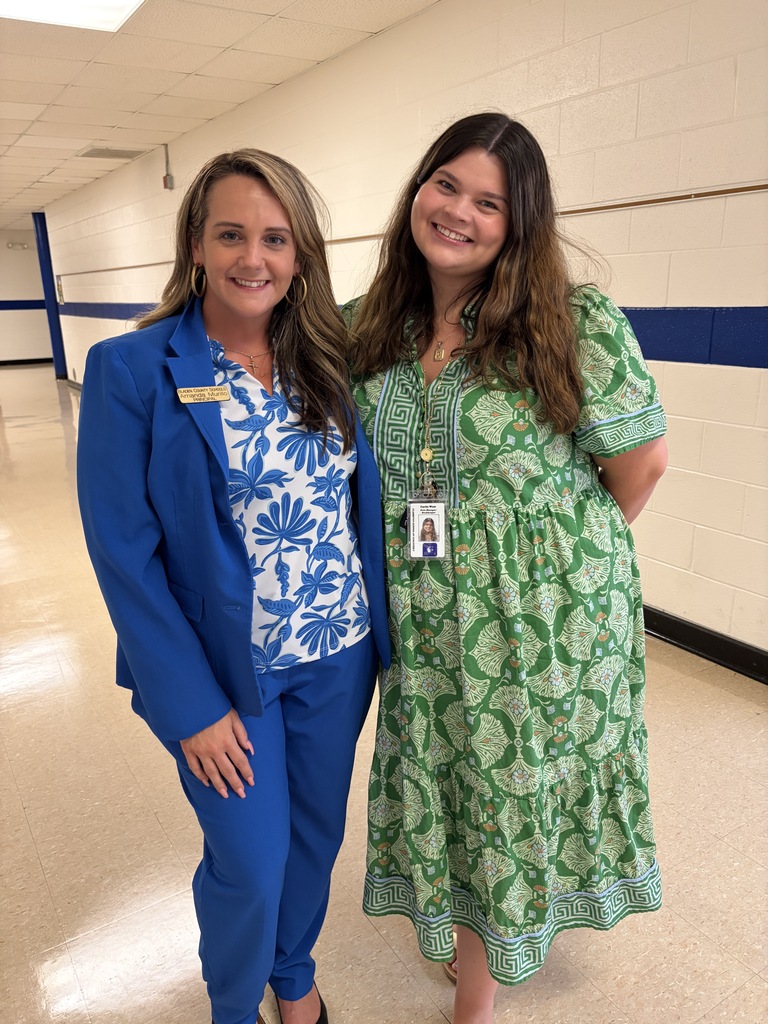 Clarkton School of Discovery's principal and a staff member stand together smiling. 