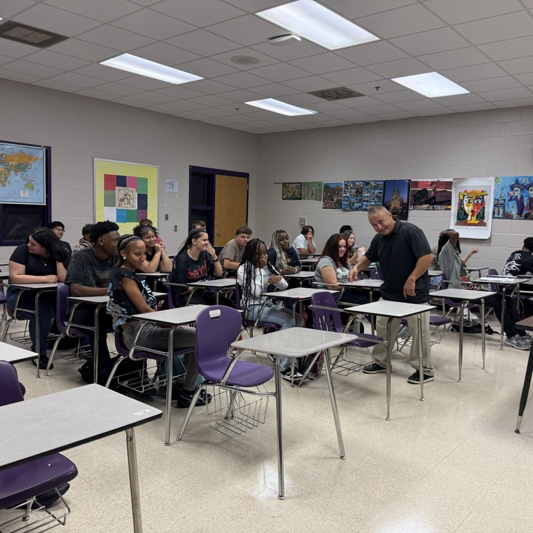 Mr Garcia and his class pose for a photo 