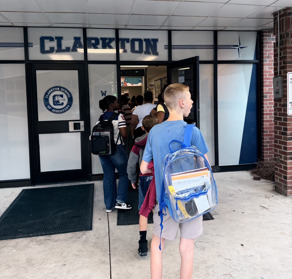 A line of students walk into Clarkton School of Discovery.