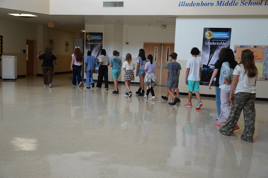 A middle school class walks through the hallway at Bladenboro Middle School.