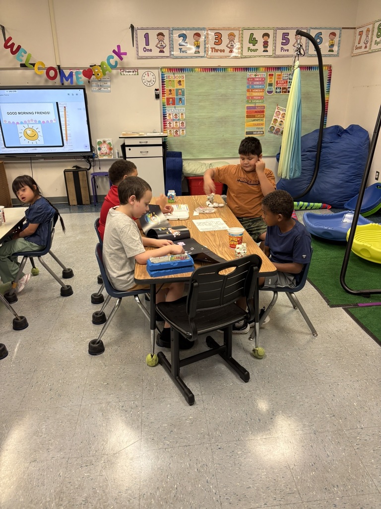Students settle into the back-to-school routine by working at their tables, following directions, and participating in classroom activities.