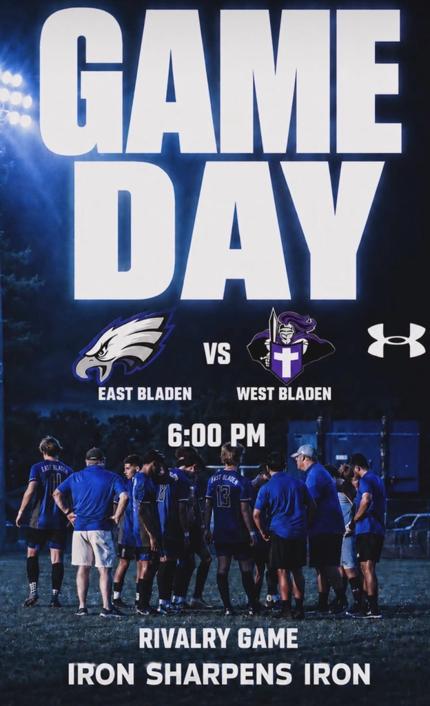 dark background picture of soccer team on a soccer field with soccer player, standing in a circle talking with blue jerseys on and black shorts. there’s a picture of an eagle versus a knight.