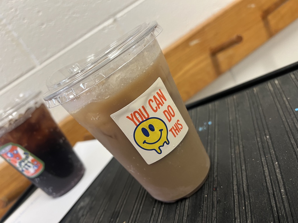 Iced coffee with positive sticker.