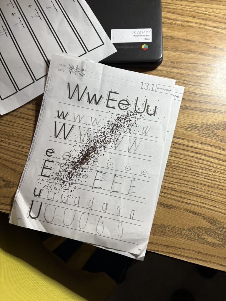 Student letter-tracing worksheet covered with sparkling fairy dust from a special Handwriting Fairy visit.
