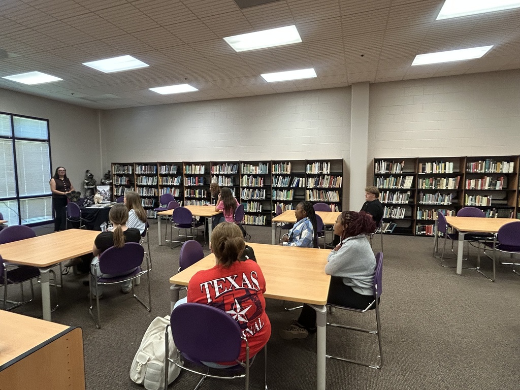 Seniors listen to a UNC Pembroke admissions representative during an information session in the school library.