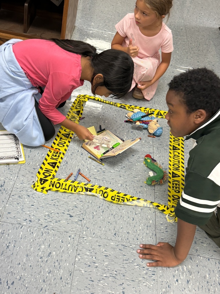 Students examine a taped-off library “crime scene” and record clues about a damaged book.