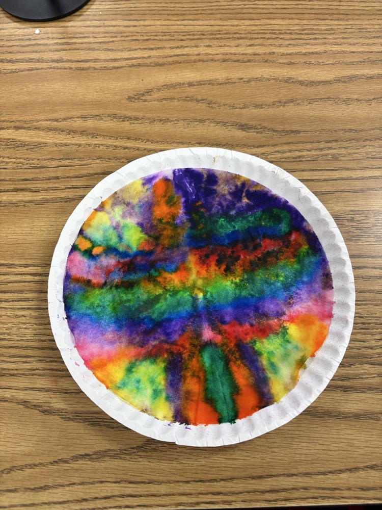 Colorful student-created Dot Day artwork made with blended rainbow colors on paper plates.