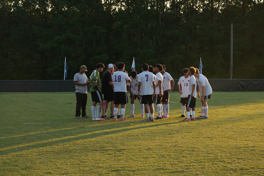 Coach Jackson and his team during a soccer match