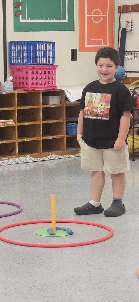 Riley Murvin standing by horseshoe stake