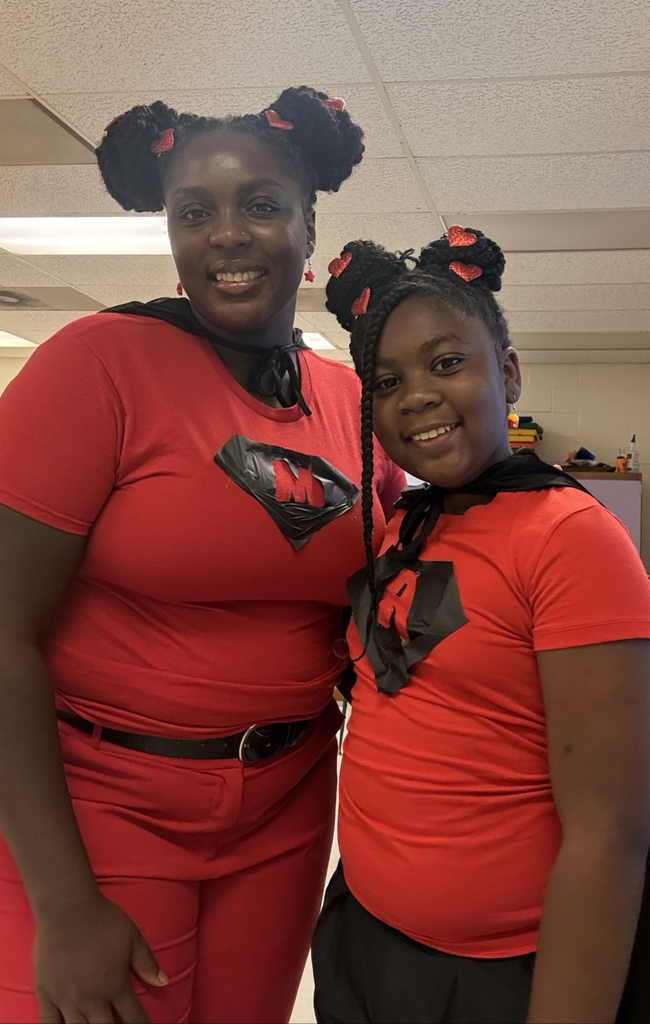 Teacher and Student smiling in classroom 