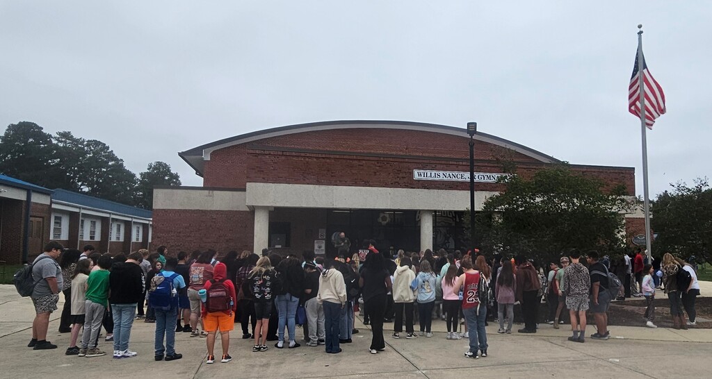 Students praying around the flag pole