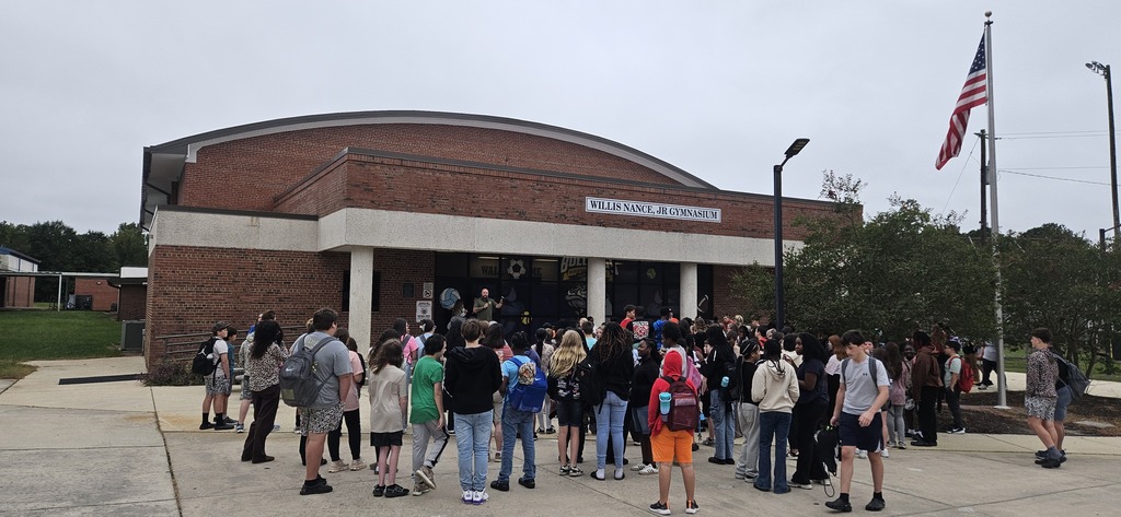 Students praying around the flag pole