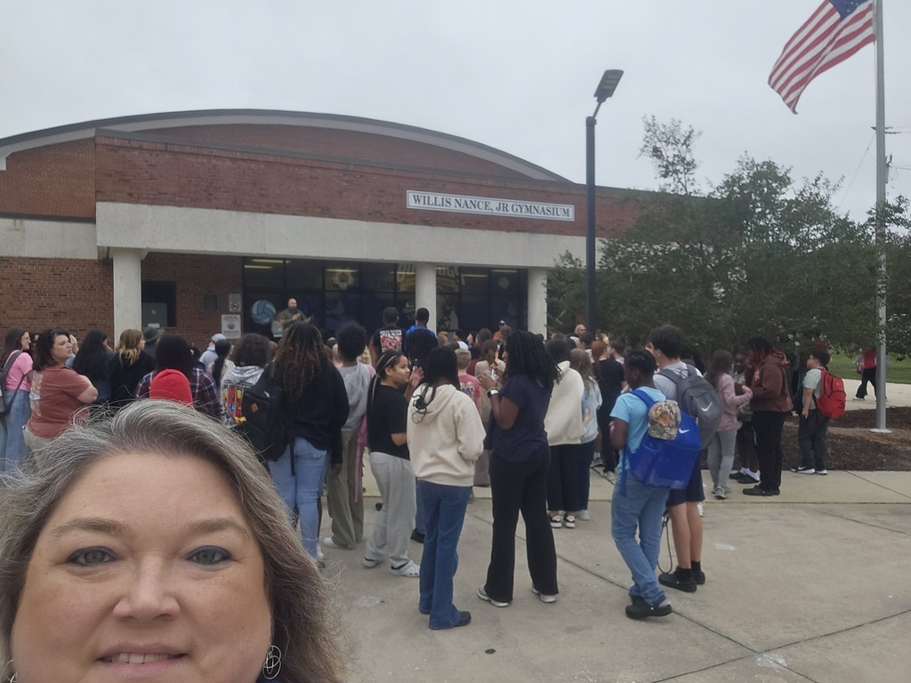 Students praying around the flag pole