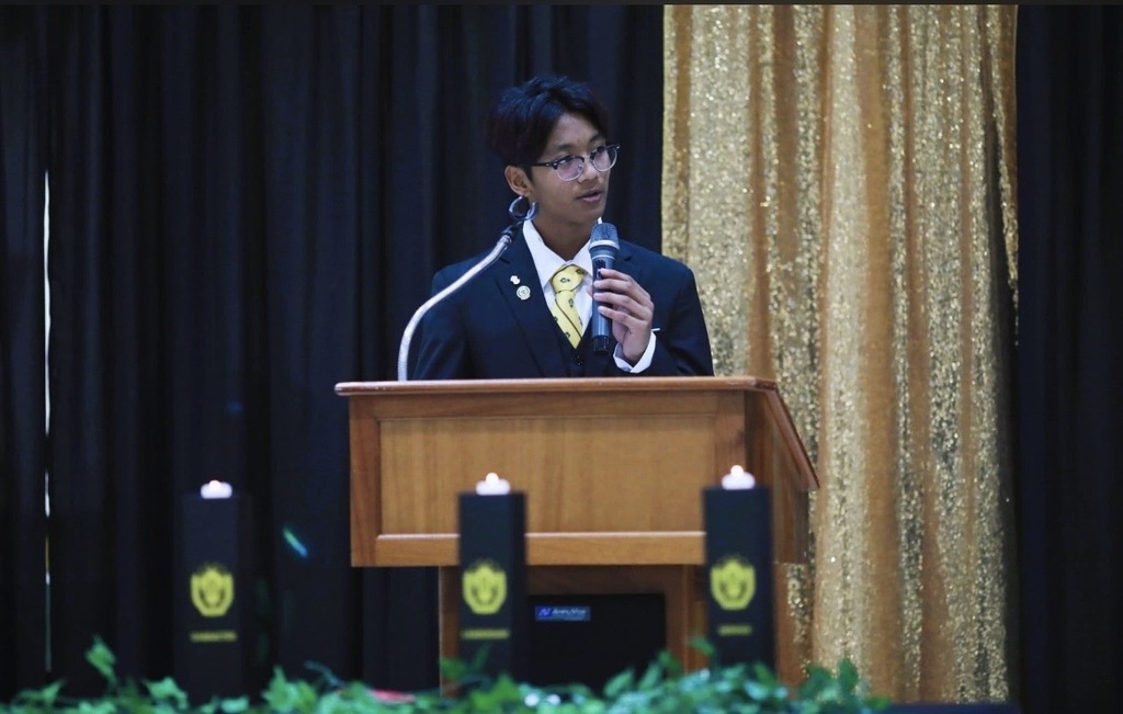 This images is of Aidan Trinidad, newly inducted president, addressing the new inductees. 