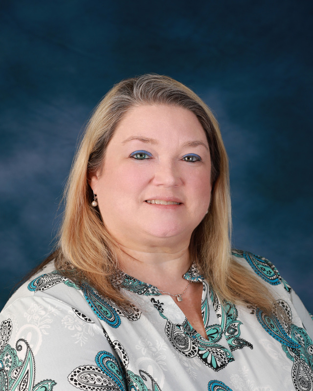 Professional headshot of Pam Bryant.