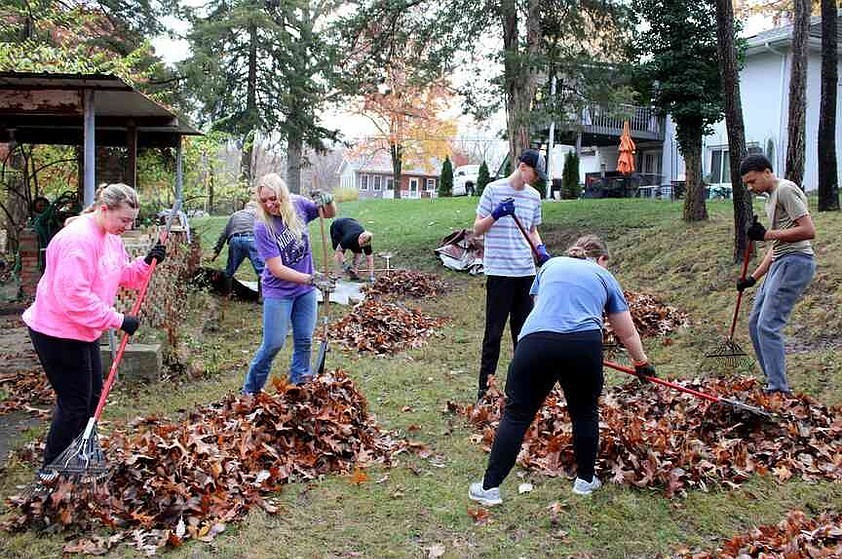 Caroline Glydewell/News Tribune photo: From left, Mayson Davis, Ainsley Stegeman, Aden Rackers, Ava Kleffner and Devontae Troy rake leaves Saturday morning, Nov. 22, 2025, as part of Operation Leaf Relief in Jefferson City.