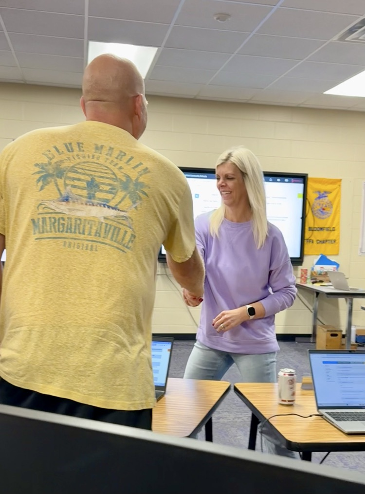 heather Gubbels shaking boe members hands