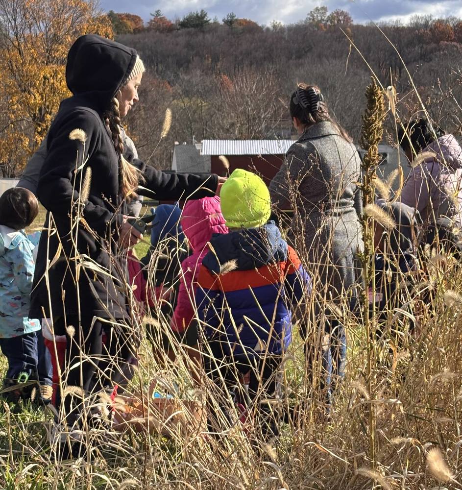 Children walking through a wheat field.