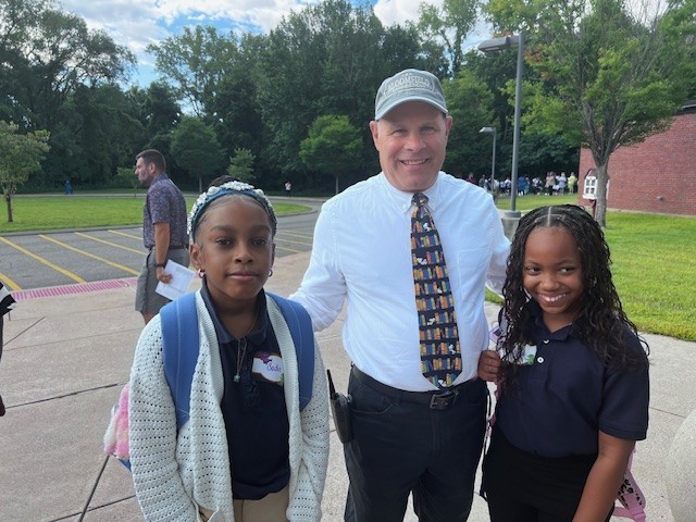 Principal with students