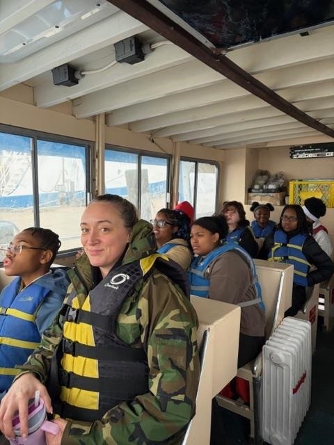 Students and teacher on the boat