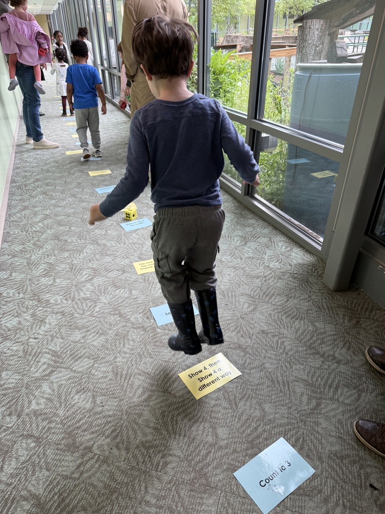Boy jumping onto spots (that are lined up)