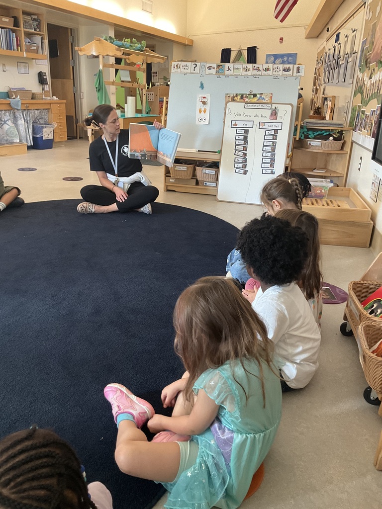 Principal Straker reads a book to students in Room 105, Mrs. Thode's classroom. 
