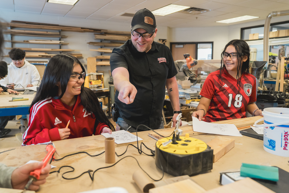 Mr. Swier and two students in the Makerspace lab