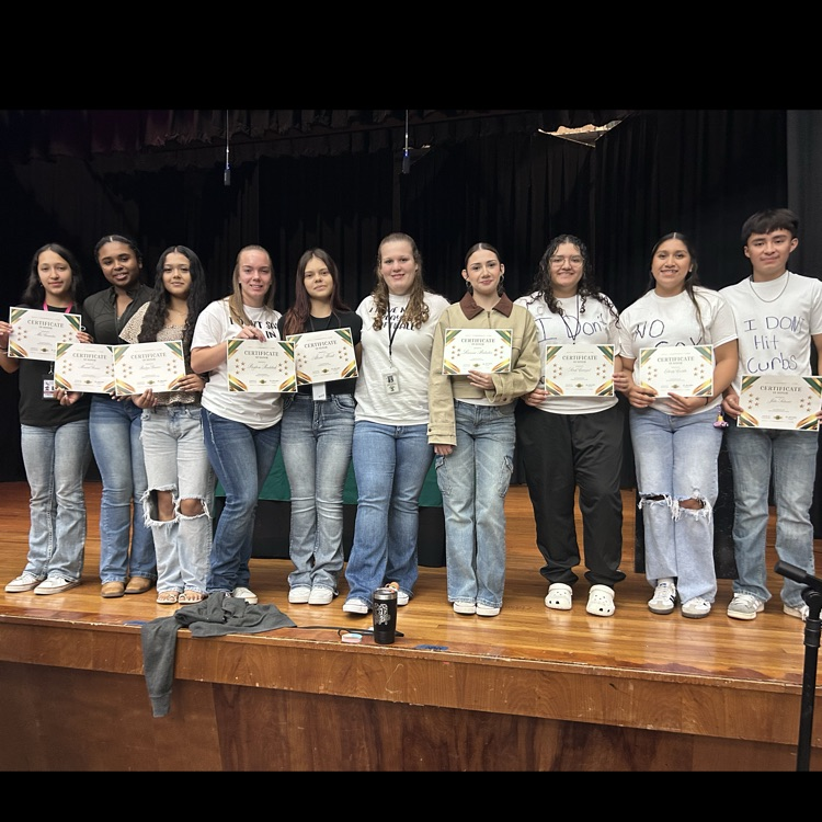 squad posing with awards