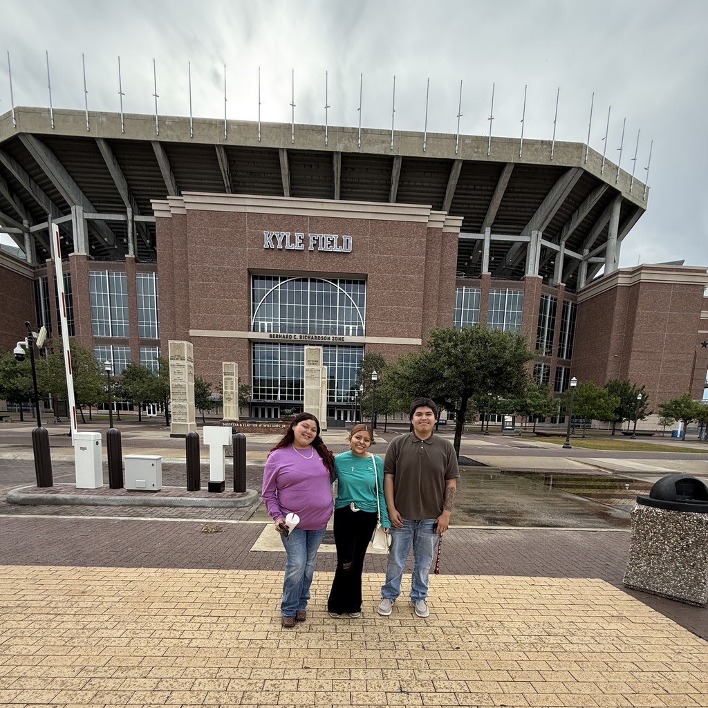 Students standing in front of Kyle Field
