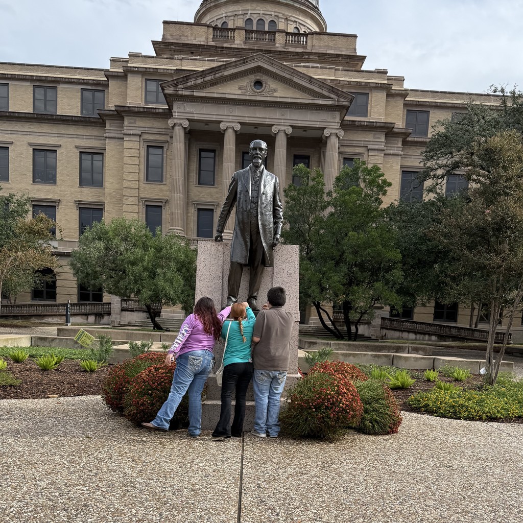 Students giving Ross a penny for good luck