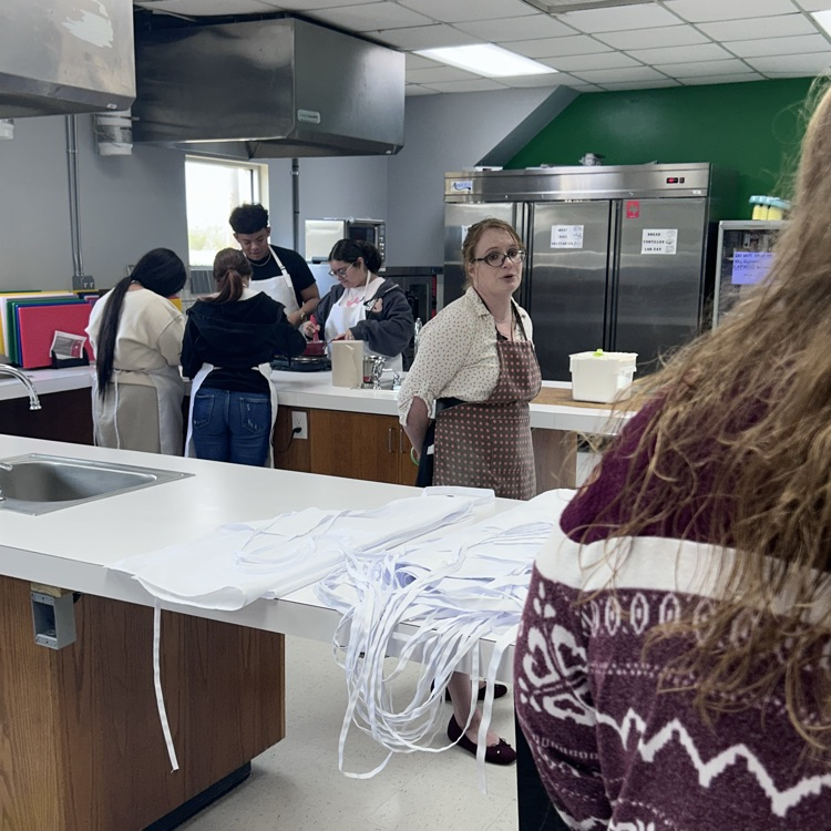 kids cook, teachers look on 