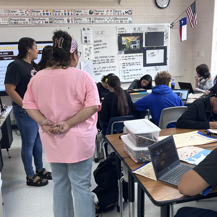 teachers look in on artists doing projects in advanced art 