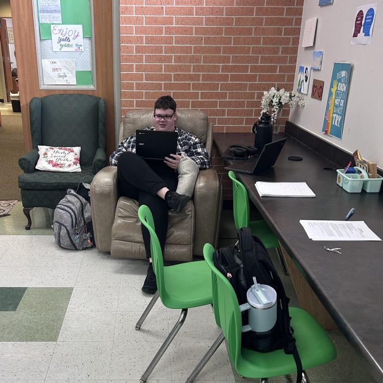 student works on their computer