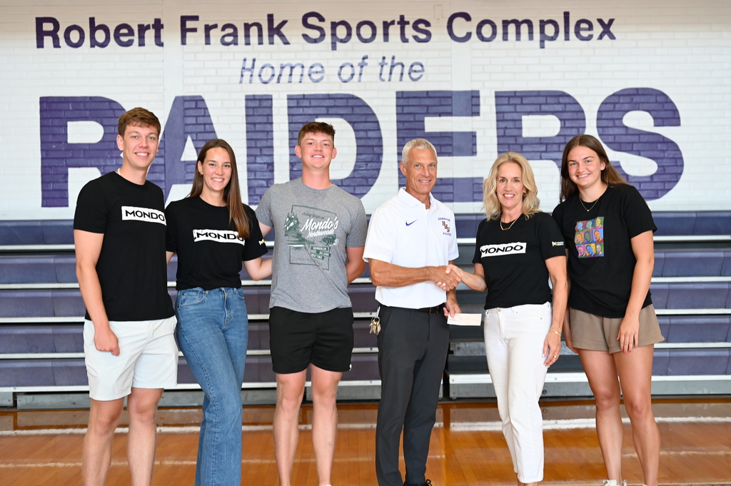 mondo's mission family presenting check