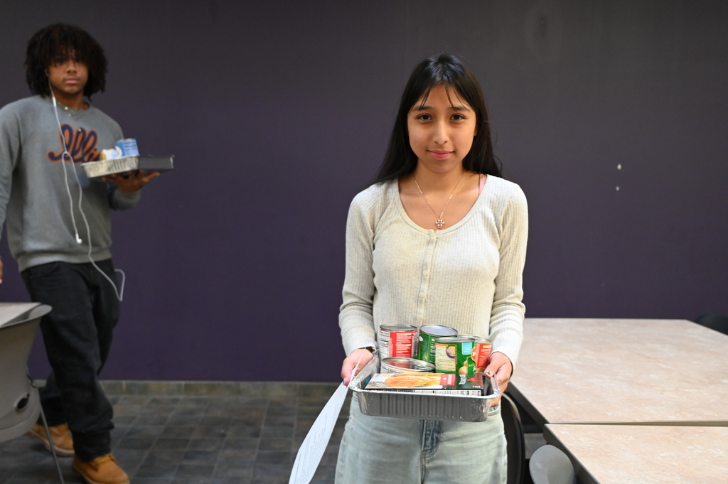Student and Promise Councils packing food
