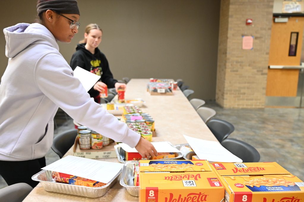 Student and Promise Councils packing food