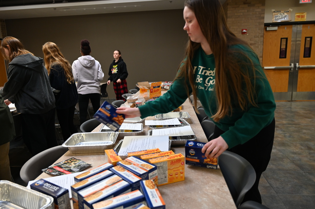Student and Promise Councils packing food