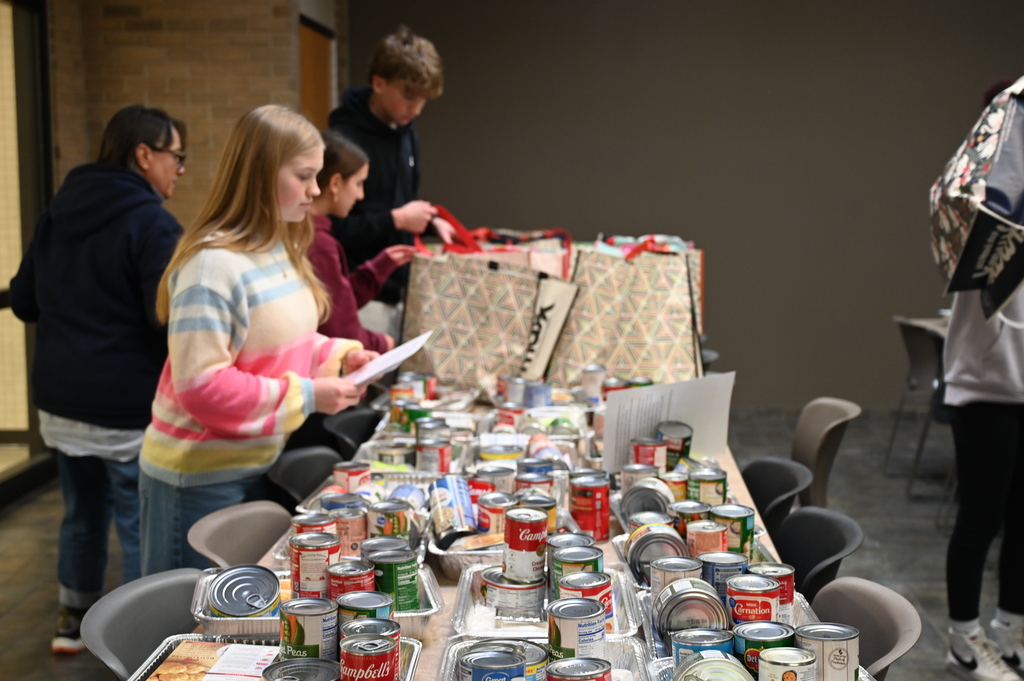 Student and Promise Councils packing food