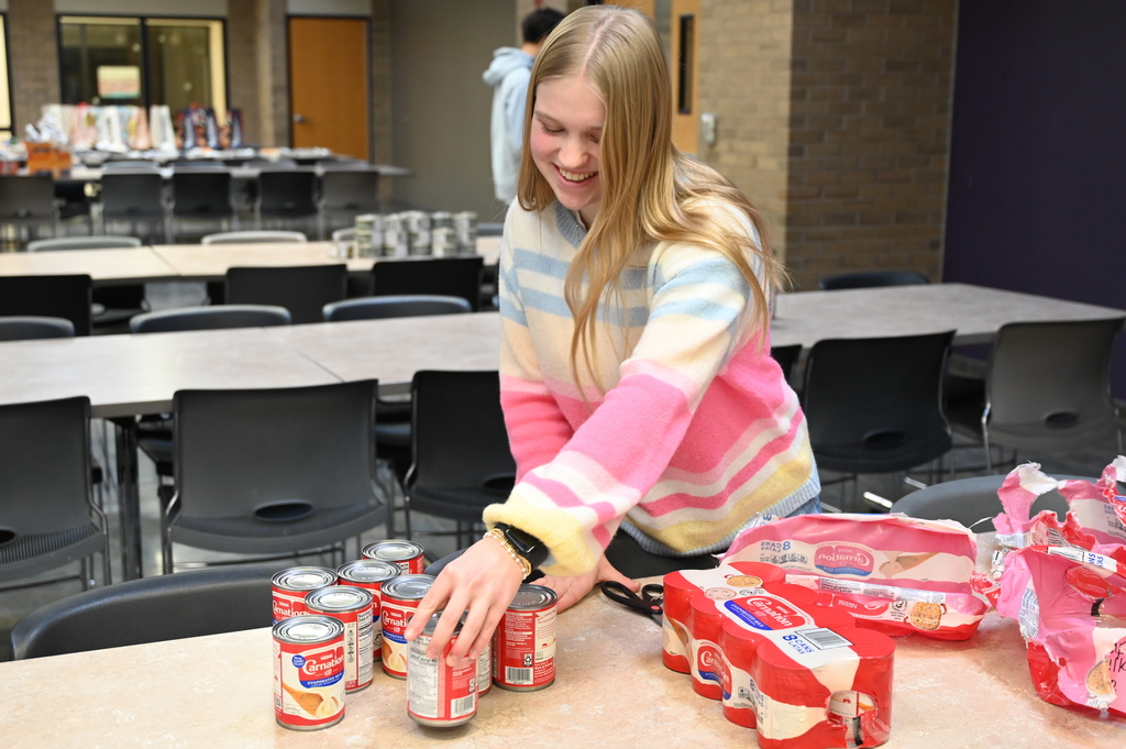 Student and Promise Councils packing food