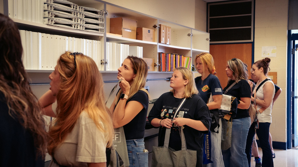 Blount County Schools educators line up inside the Teacher Depot and browse shelves filled with binders, folders, and classroom supplies.