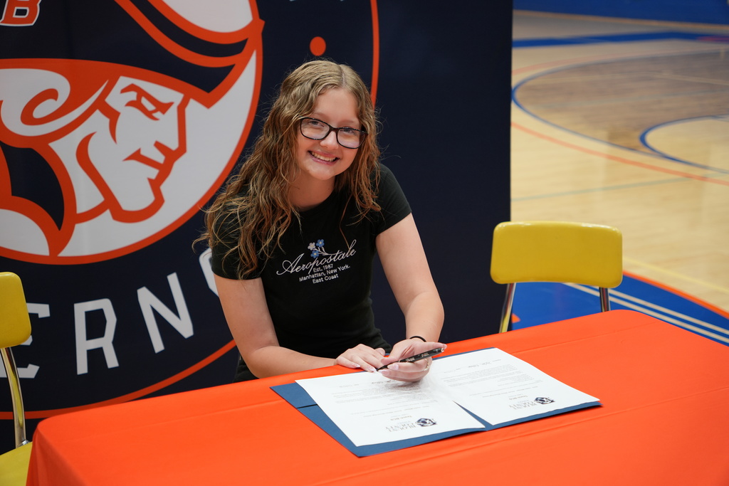 student signing teach bcs