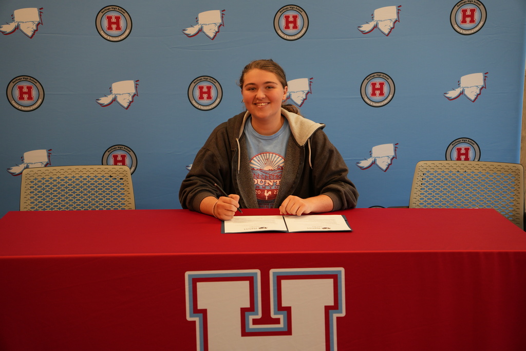 student signing teach bcs
