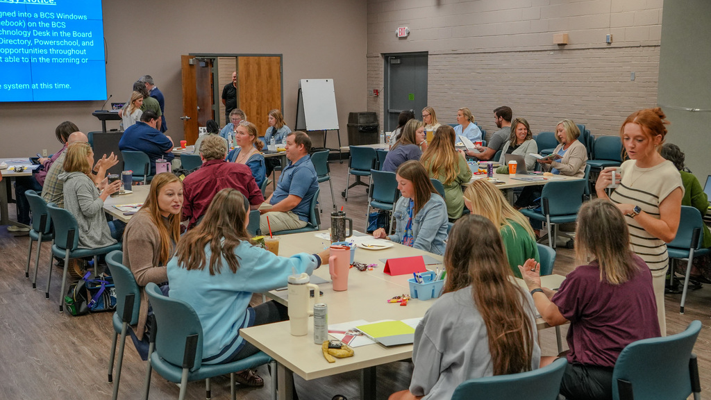 teachers at tables working