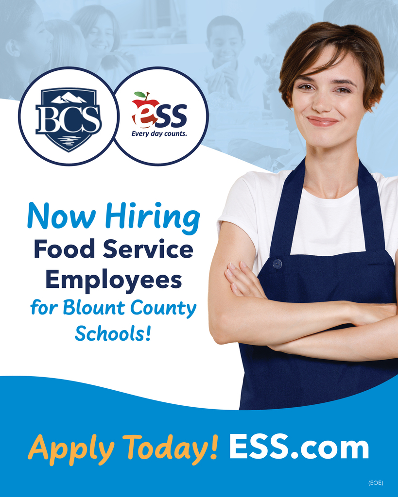 Promotional social media graphic featuring a smiling woman in a navy blue apron with her arms crossed, alongside the logos for Blount County Schools and ESS. The text reads: "Now Hiring Food Service Employees for Blount County Schools! Apply Today! ESS.com."