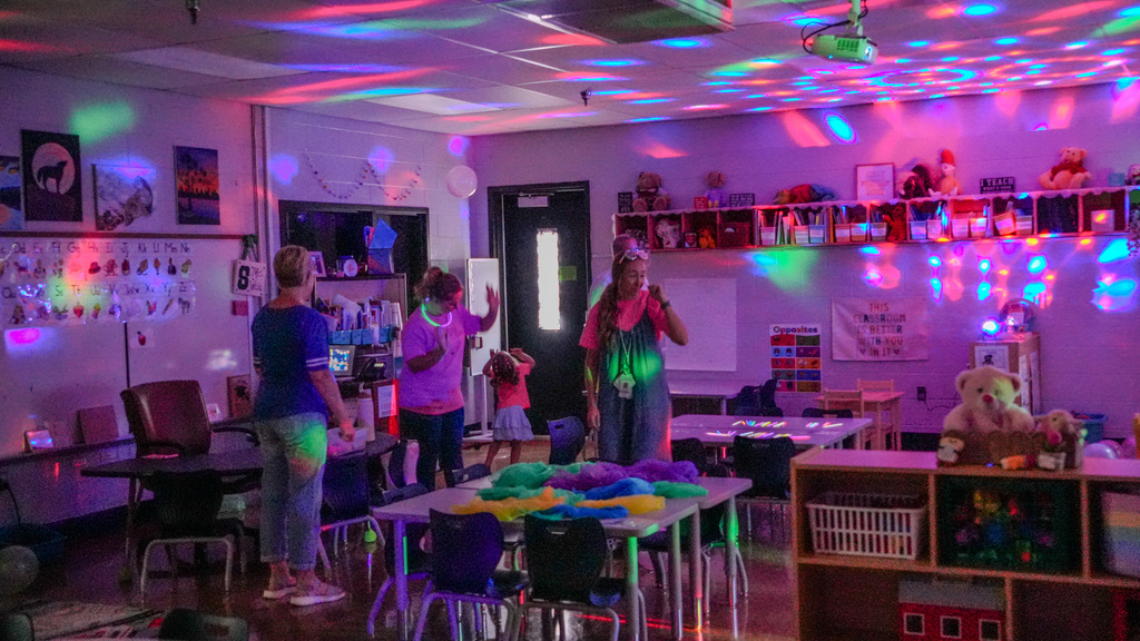Dance party in classroom with the lights out. 