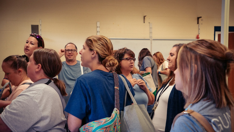A crowded room of Blount County Schools educators browse classroom supplies and carry Teacher Depot bags during opening morning.